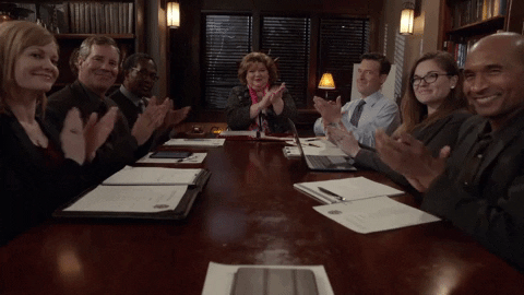 table of people clapping